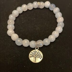 Elegant Silver tone and light blue bead Charm Bracelet